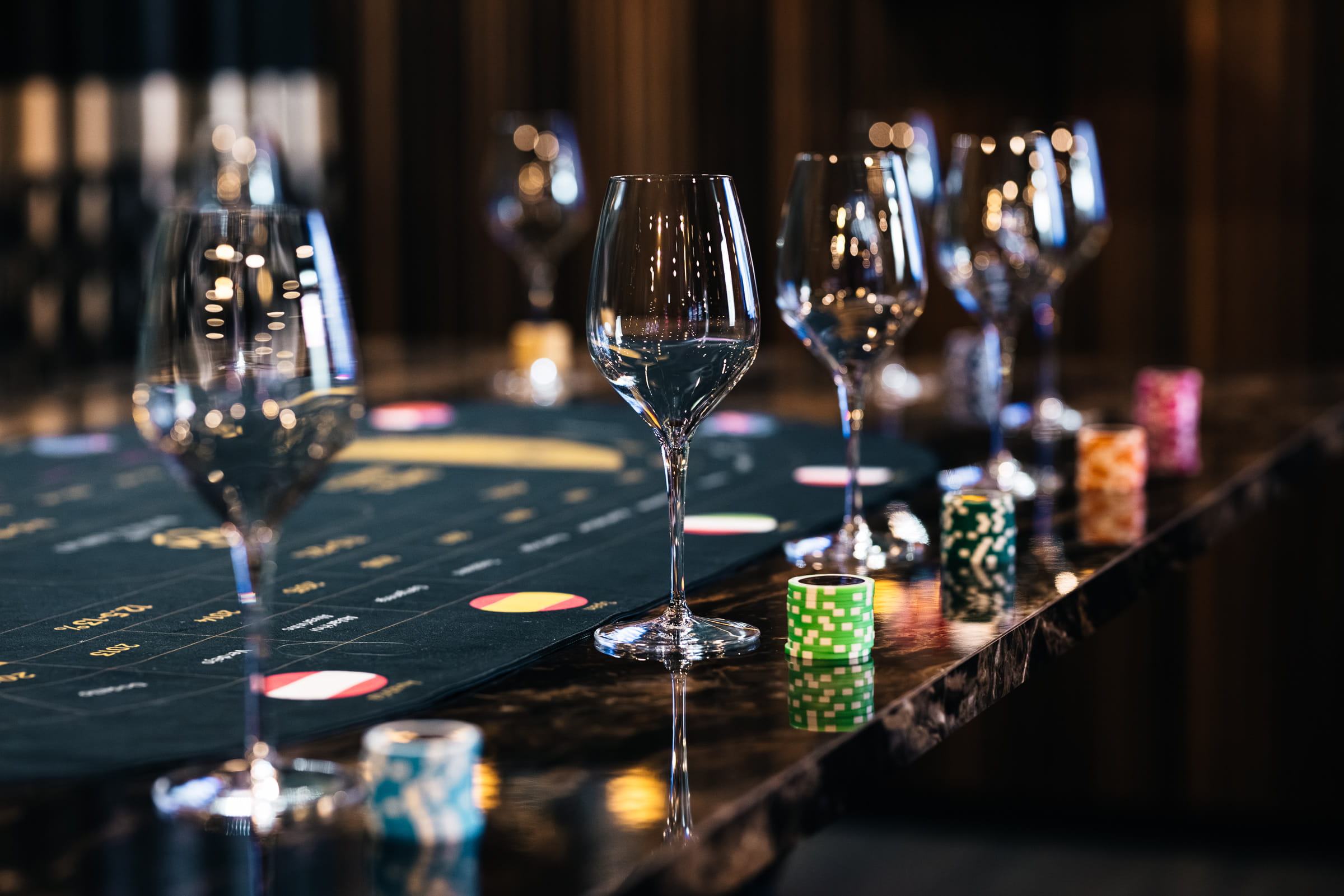 Guests enjoying an immersive wine casino experience at DorianGrey Tallinn with wine tasting games, elegant table setup, and Art Deco atmosphere